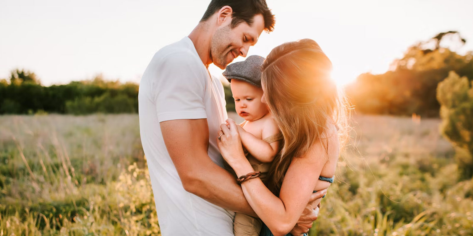 Young couple holding baby